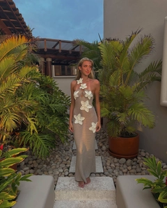 Detailed close-up of khaki crochet halter maxi dress with white 3D floral cutout patterns