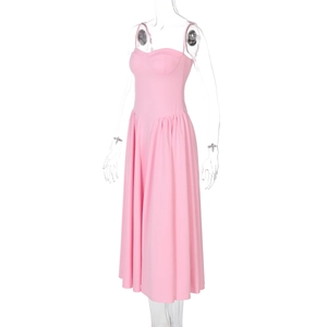 Close-up of pink slim fit backless midi dress featuring ruched skirt and bust shaping
