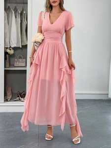 Detail of pink chiffon V-neck dress featuring ruffled hem and high waist design