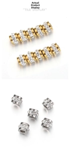 Makroaufnahme von 18k vergoldeten und silbernen Abstandsperlen mit Kristall-Strass-Inlay