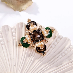 Baroque cross brooch with freshwater pearls and green enamel on a vintage shell plate