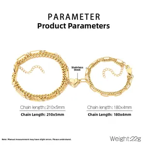 Detail of magnetic heart clasp connecting golden stainless steel layered chain bracelets