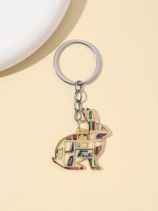 Detail shot of a rabbit acrylic keychain featuring a bookshelf pattern and silver ring
