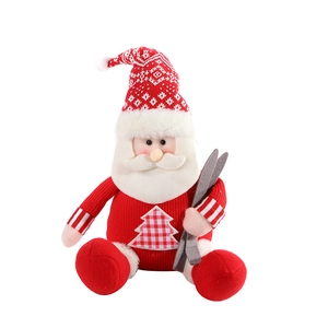 Cute knitted Santa Claus plush doll with skis for festive Christmas home shelf decoration