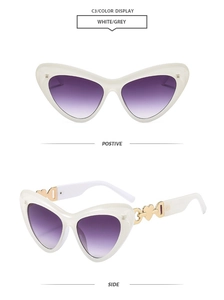 Detailed views showing gold heart chain temples on white cat-eye sunglasses with purple lenses