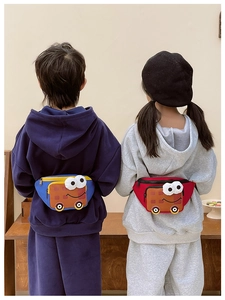 Kids cartoon bus crossbody bags shown on two models with vibrant blue and red contrast colors