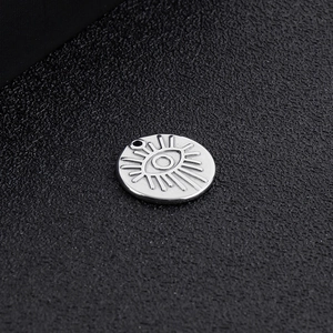 Polished silver stainless steel round pendant with engraved geometric eye of providence
