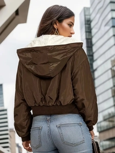 Dark brown hooded bomber jacket with soft white fleece lining and ribbed cuffs shown from behind
