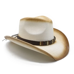 Detail of woven straw cowboy hat featuring brown gradient edges and ethnic beaded band