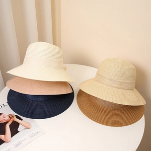Women's woven straw sun hat with bow tie in assorted colors for beach and summer travel