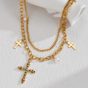 Double-layered gold cross necklace with colorful gems, blue eye charm and pearls