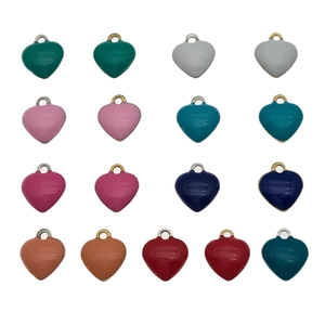 Colorful heart pendants in various enamel colors with gold and silver metal ring hooks