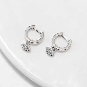 Detailed view of S925 sterling silver hoop earrings with sparkling evil eye charms