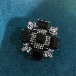 Vintage geometric brooch with black rectangular stones and crystals on teal velvet