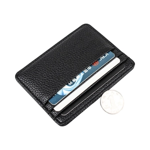Slim litchi texture black leather card holder with three slots on white background