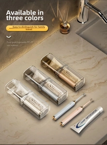 Close-up of portable travel toothbrush cups in transparent gray and amber with air vents
