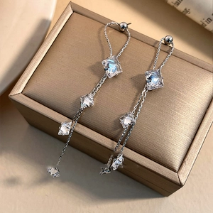 Silver long tassel earrings with sparkling zircon stars and geometric diamond pendants