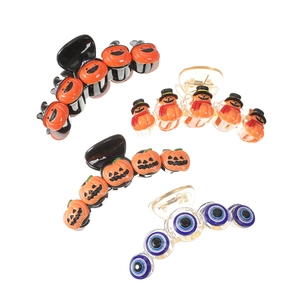 Quirky Halloween hair claws featuring pumpkin, snowman, and devil eye designs for party