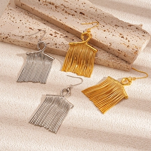 Long metal tassel drop earrings with knot design in gold and silver finish