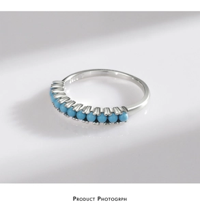 Macro shot of S925 sterling silver ring featuring ten inlaid turquoise beads