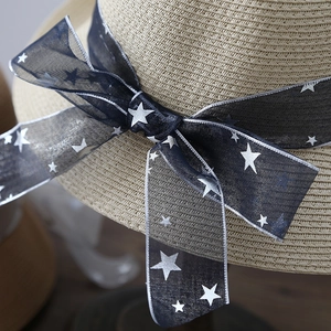 Women's summer straw sun hat with stylish blue star ribbon bow and wide brim design