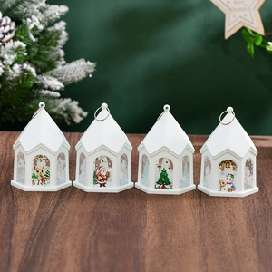 Set of 4 white Christmas lanterns with deer, Santa, and snowman on wooden surface