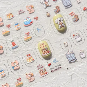 Macro shot of 3D embossed nail stickers with cute cartoon bears and strawberry cake designs