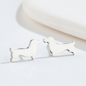 Minimalist silver stainless steel dachshund dog stud earrings on white background