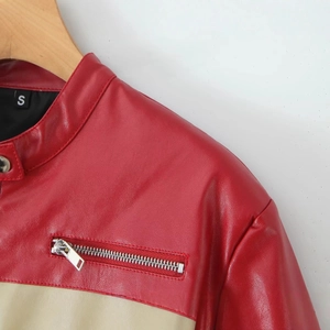 Short PU biker jacket with red and cream leather patchwork and a standing collar