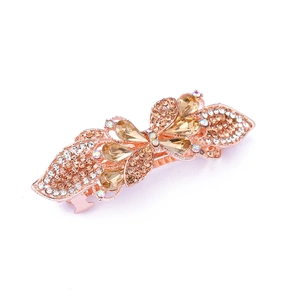 Close-up of alloy spring hair clip with rhinestones in rose gold floral design