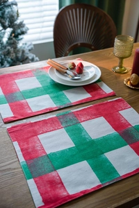 Detail showing classic red and green checkered placemats in cotton linen for Christmas decor