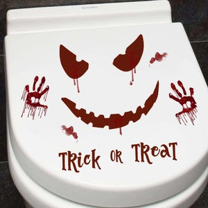 Halloween bloody handprint and smile face sticker on toilet lid with Trick or Treat text
