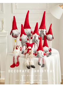 Detail of Christmas gnomes in red and grey with long legs and knitted texture hats
