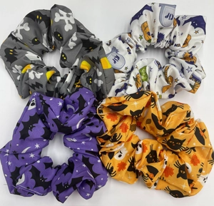 Detailed set of 4 Halloween scrunchies with spooky patterns on a white background