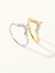 Detail of V-shaped crown rings in gold and silver with sparkling marquise zirconia