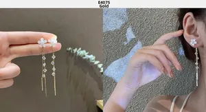 Detail of gold flower tassel earrings with S925 silver needle and long dangling chains