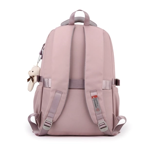 Pink lightweight waterproof backpack with bear pendant and padded straps, back view