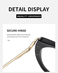 Close-up of golden spring hinge on black cat-eye glasses for smooth opening