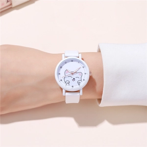 Detail of white quartz watch face featuring cute kitten illustration and white strap