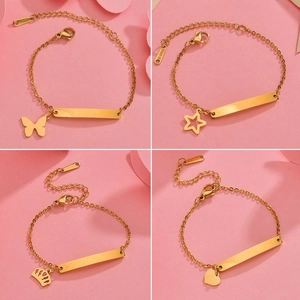 Polished gold stainless steel ID bracelets with heart, star, crown, and butterfly charms