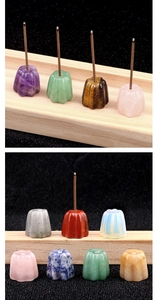 Macro detail of various natural crystal incense holders in flower and pumpkin shapes