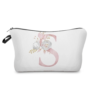 Close-up detail view of a white cosmetic bag featuring a pink floral alphabet S print