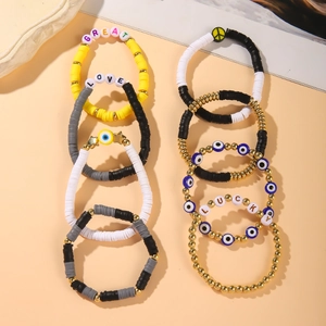 Collection of bohemian clay bead bracelets with GREAT LOVE LUCKY letters and evil eye charms
