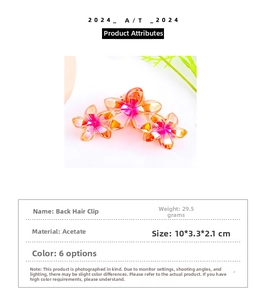 Detail view of large acetate plumeria hair claw clip with size and weight measurements