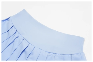 Detail view of light blue tennis skirt featuring high waist and fine pleated fabric