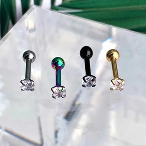 Detail of four-color stainless steel stud earrings with round-cut cubic zirconia settings