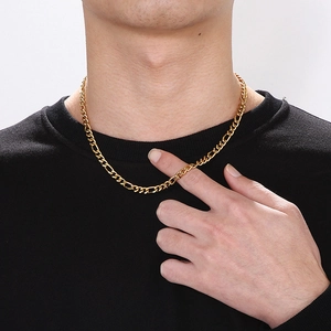 Golden titanium steel NK curb chain necklace for women on a model with black clothing