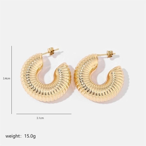 Detail of gold chunky C-hoop earrings with vertical pleated texture and 3.4cm height