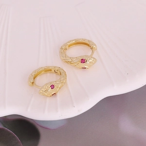 Minimalist 18K gold snake hoop earrings with ruby zircon eyes and scale texture