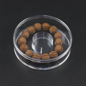 Premium walnut shell beaded bracelet in a clear round display storage gift box